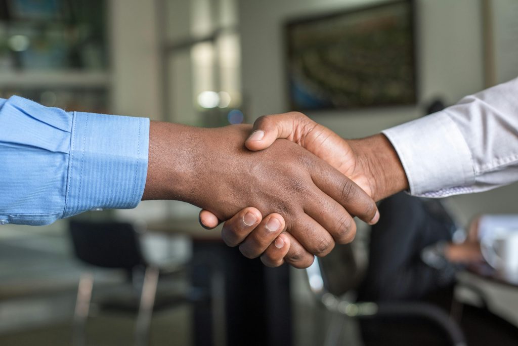 africana business men shaking hands